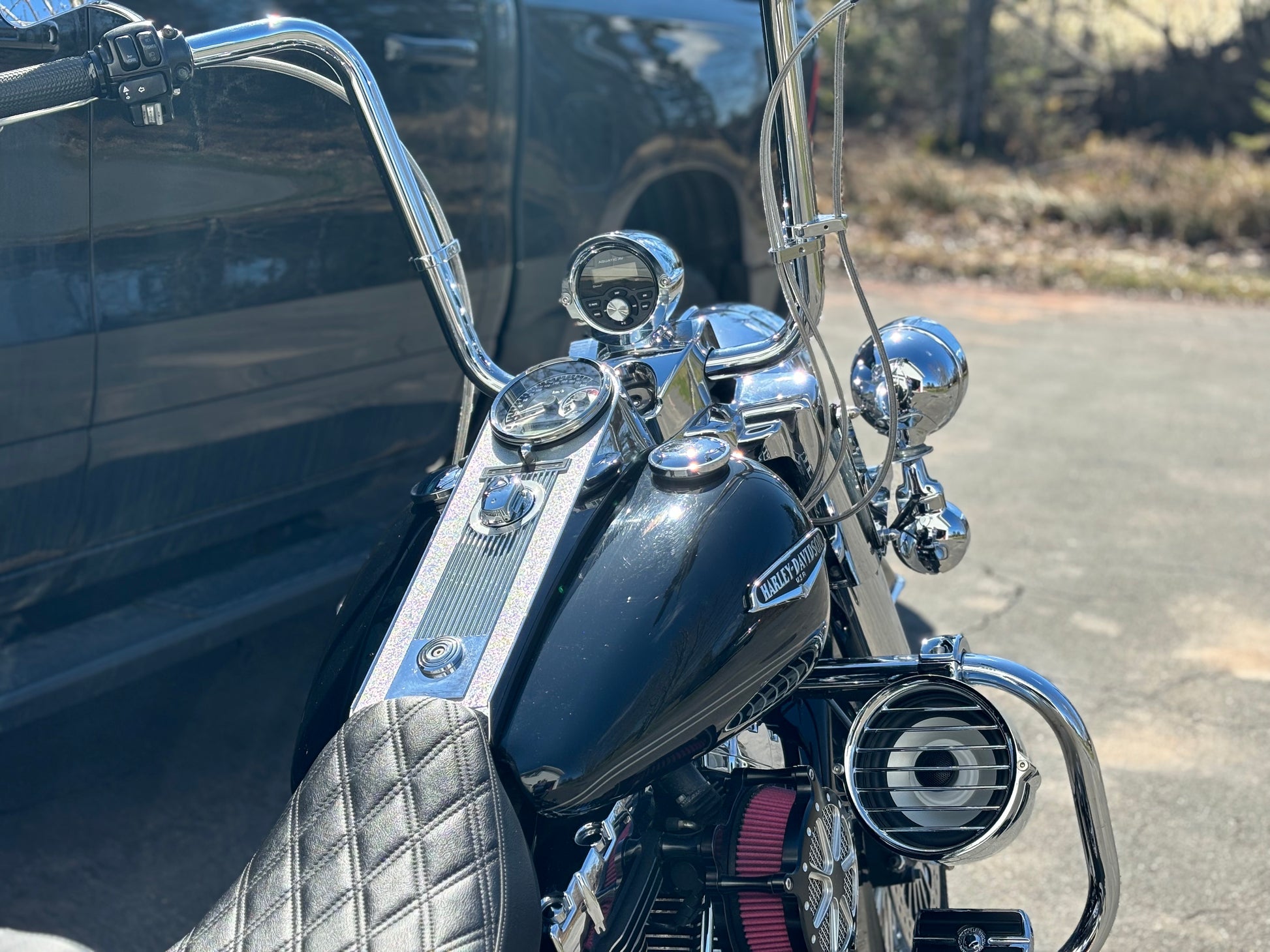 Harley-Davidson Road King with Aquatic AV GP1 head unit in billet nacelle cap and 6.5 inch HRS highway bar speaker pod installed on the engine guard