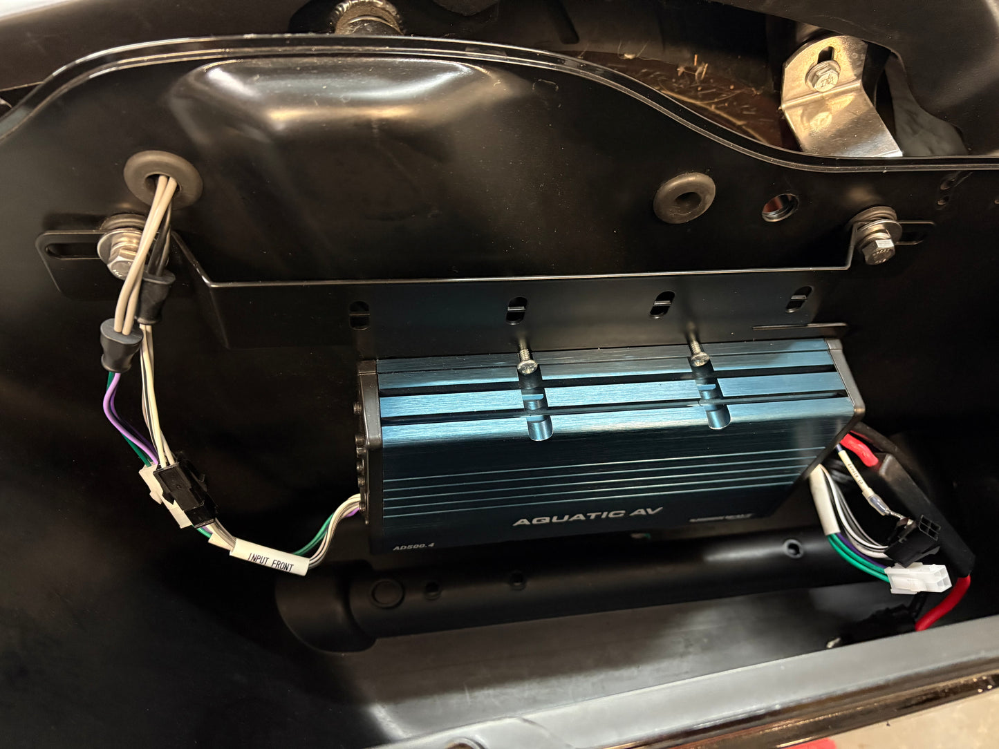 Aquatic AV 300 watt amplifier mounted on Havoc Roadlock saddlebag bracket for Road King